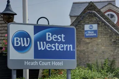 a sign in front of a health centre hotel at Best Western Heath Court Hotel in Newmarket