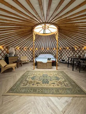 a room with a bed in a yurt at The Isla Yurt in Colchester
