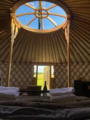 a room with a large window in a yurt at The Isla Yurt in Colchester