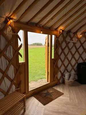a room with a large window in a yurt at The Isla Yurt in Colchester