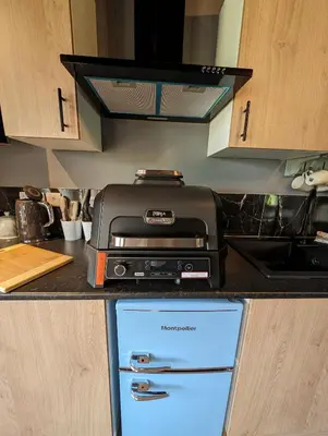 a kitchen counter with a printer on top of a refrigerator at Lake View lodges The Lavenham in Long Melford