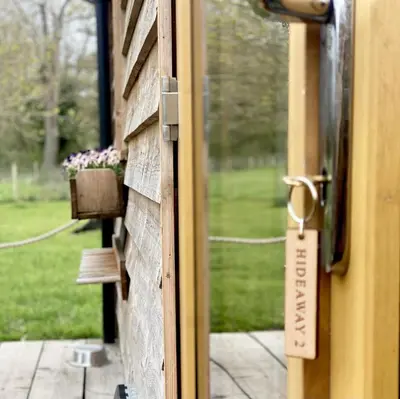 a door with a sign that reads entrance to a house at Honeywood Farm Cabins in Woodham Ferrers