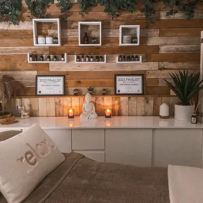 a room with a desk with a statue and candles at Honeywood Farm Cabins in Woodham Ferrers