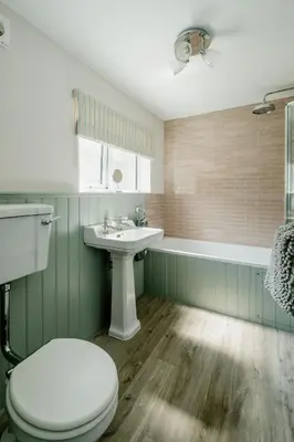 a bathroom with a toilet and a sink at Wigeon Cottage, Aldeburgh - Sleeps 4 - Adults only house in Aldeburgh