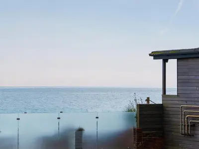 a view of the ocean from a house at Cannon Corner by The Suffolk Cottage Collection in Aldeburgh