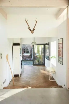 a living room with a refrigerator and a table at The Skyroom in Rendham