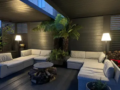 a living room with couches and a table and plants at Stunning designer House in excellent city location in Cambridge