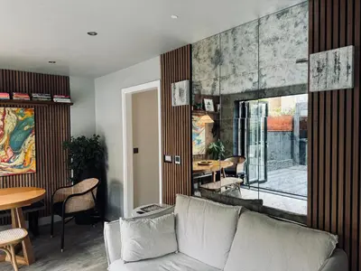 a living room with a couch and a table at Stunning designer House in excellent city location in Cambridge