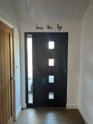 a black door with the words love yourself above it at 3 Bed Barn in Cambridge next to Anglesey Abbey in Cambridge