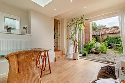 a living room with a table and chairs at 3 Bed in Snape oc-g29478 in Snape