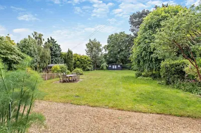a large yard with a picnic table and a house at 3 Bed in Snape oc-g29478 in Snape