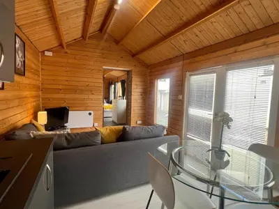 a living room with a couch and a table at Duchess Lodge In Colchester 1BR,Couples, Contractors,Business Travellers, Free WIFI, Secure Parking in Colchester