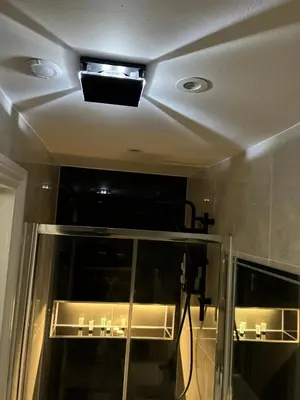 a ceiling with a light in a room at Stylish Flat in London in Harold Wood