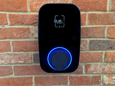 a black remote control on a brick wall at Dovecote Cottage in Downham Market