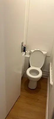 a bathroom with a white toilet in a room at Newmarket house in Newmarket