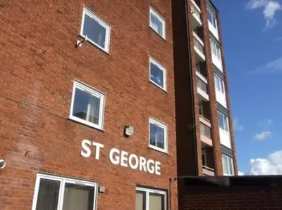 a brick building with st george written on it at Newmarket house in Newmarket