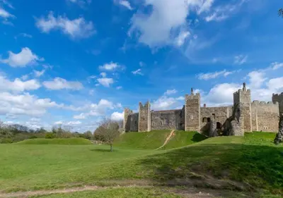 an old castle on a grassy hill at The Keep - Framlingham in Framlingham