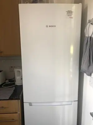 a white refrigerator in a kitchen with a bag on it at Basildon, private room in a flat in Basildon