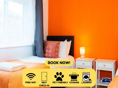 a room with a bed and a sign that says book now at Cozy 4-guest Getaway In The Heart Of Ipswich in Ipswich