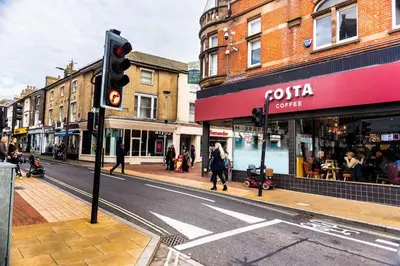 a traffic light on a city street with buildings at Cozy 4-guest Getaway In The Heart Of Ipswich in Ipswich