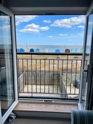 a view from the window of a balcony at Stunning Beachfront House in Felixstowe