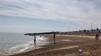 a group of people playing on the beach at Stunning Beachfront House in Felixstowe