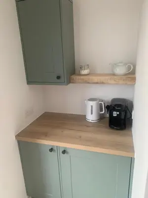 a kitchen with a counter top with a coffee maker on it at The Greyhound Pub in Tibenham