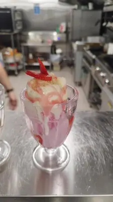 a dessert in a glass bowl on a counter at The Greyhound Pub in Tibenham