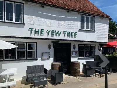 a building with a sign that reads the twenty tree at Stay and Relax at The Yew Tree in Manuden