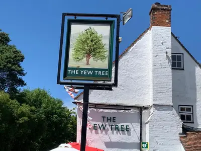 a sign that says the new tree in front of a building at Stay and Relax at The Yew Tree in Manuden