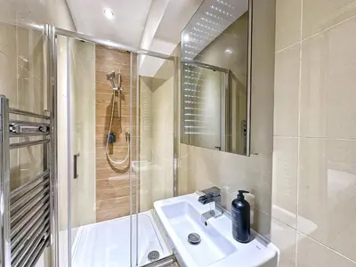 a bathroom with a sink and a shower at Gwydir Street Stays in Cambridge