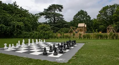 a chess board on a lawn with a chessboard at Down Hall Hotel in Bishops Stortford