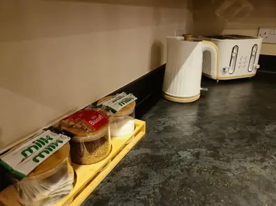 a kitchen with a counter with food and a toaster at Contractors l FreeParking l Station l Students in Colchester
