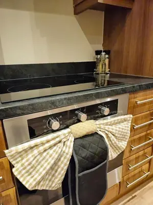 a kitchen with a stove with towels on the oven at Contractors l FreeParking l Station l Students in Colchester