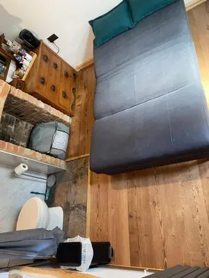 a large black bed in a tiny house at The old wash house in Denver