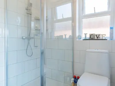 a bathroom with a shower and a toilet at Comfortable home Langdon Hills - Pass the Keys in Basildon