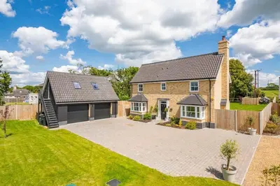a large brick house with a large driveway at Kestral House in Eye