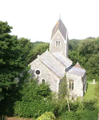 an old stone church in the middle of the forest at The Old Coach House in Bungay
