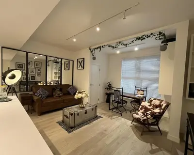 a living room with a couch and a table at Modern Ipswich Waterfront Apartment Free Parking - Long Term Stays Available in Ipswich