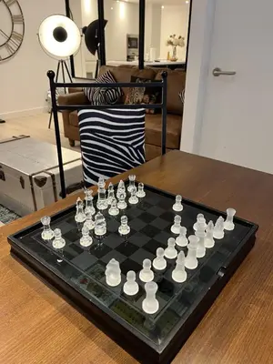 a chess board on a table in a living room at Modern Ipswich Waterfront Apartment Free Parking - Long Term Stays Available in Ipswich