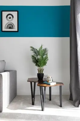 a potted plant sitting on a coffee table in a living room at Stunning Spacious 4 Bed bungalow in Southend-on-Sea