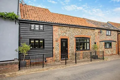 a brick house with a black exterior at 2 Bed in Rede oc-t29450 in Rede