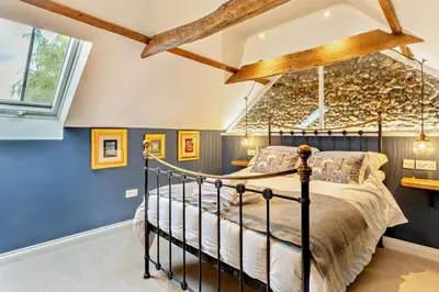a bedroom with a bed and blue walls at 2 Bed in Rede oc-t29450 in Rede