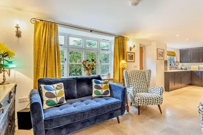 a living room with a blue couch and a chair at 2 Bed in Rede oc-t29450 in Rede
