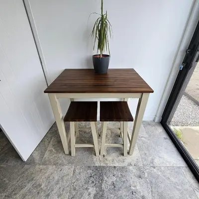 a small wooden table with a potted plant on it at Field View in Elmswell