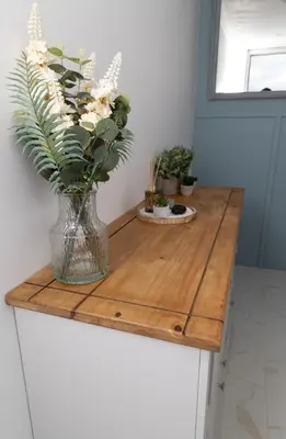 a vase of flowers on a wooden counter top at The Retreat- amazing scenic views of the Essex countryside! in Salcott