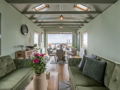 a living room with a couch and a table at The Pontoon - Pass the Keys in Southend-on-Sea