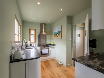 a kitchen with a sink and a stove at The Pontoon - Pass the Keys in Southend-on-Sea