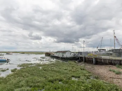 a marina with boats on the water on a cloudy day at The Pontoon - Pass the Keys in Southend-on-Sea