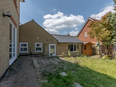a house with a yard in front of it at Comfortable 2 Bed Apartment Pass the Keys in Basildon